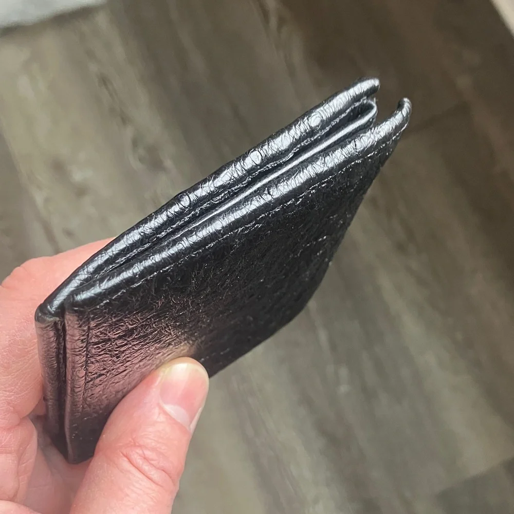 black bifold wallet made from genuine ostrich leather.